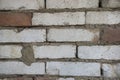 Old red brick wall colored in white with cobwebs here and there. Vintage dirty brick wall.