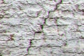 Old red brick wall covered with a white plaster and a large cracked. Texture background. Digital signal glitch effect rgb shift, Royalty Free Stock Photo