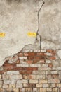 Old Red Brick wall with damaged grey plaster background