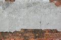 Old Red Brick Wall With Damaged Grey Plaster Background