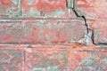 Old red brick wall with fissure, grunge texture background Royalty Free Stock Photo