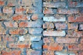 Old red brick wall with fissures, grunge texture background Royalty Free Stock Photo