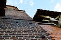 Old red brick wall of a medieval castle against the blue sky. The background Royalty Free Stock Photo
