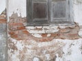 Old Red Brick Wall, with old window, with Cracked Concrete Background Texture Royalty Free Stock Photo