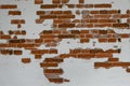 Old red brick wall partially plastered and white painted, background texture for historical architecture concepts, copy space Royalty Free Stock Photo