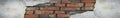 Old red brick wall surface with crumbling white plaster. Grunge background with space for design. Web banner. Wide. Long. Royalty Free Stock Photo