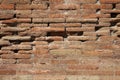 Old red brick wall texture background with scratches, cracks, dust, crevices, roughness.