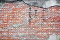 Old red brick wall texture with cracked concrete stucco layer background Royalty Free Stock Photo