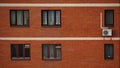 Old red brick wall with windows in Moscow. Urbain background Royalty Free Stock Photo