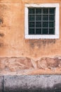 Old red brick wall with two rusted iron grill windows Royalty Free Stock Photo