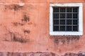 Old red brick wall with two rusted iron grill windows Royalty Free Stock Photo