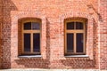 An old red brick wall with two Windows Royalty Free Stock Photo