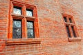 Old red brick wall with two windows Royalty Free Stock Photo