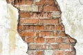 Old red brick wall with white damaged plaster background Royalty Free Stock Photo