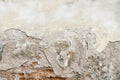 Old red brick and white plaster wall with cracked shabby surface texture background.