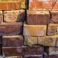 Old red bricks carefully stacked for later recycling