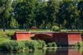 Old red bridge in the city Dobrush, Belarus. Royalty Free Stock Photo