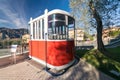 Old red cable car in front of the new cableway Malcesine-Mount B