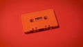 Old red cassette tape on a minimalist background