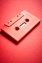 Old red cassette tape on a minimalist background Royalty Free Stock Photo