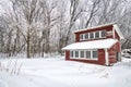 Old red chicken coop covered in snow. Royalty Free Stock Photo