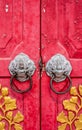 Old red chinese temple door with crave leaf Royalty Free Stock Photo