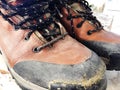 Old red dirty high shoes . Old school vintage worn boots Royalty Free Stock Photo