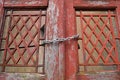 Old red door closed with chain Royalty Free Stock Photo