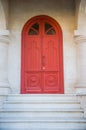 Old red door on a stone building Royalty Free Stock Photo