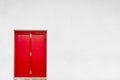 Old red door with white wall Royalty Free Stock Photo