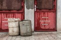 Old red doors with garbage baskets Royalty Free Stock Photo