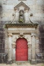 Old red wooden doors and old decorative wall Royalty Free Stock Photo