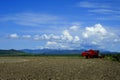 Old Red Farm Equipment in Country Farm Field Royalty Free Stock Photo