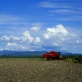 Old Red Farm Equipment in Country Farm Field Royalty Free Stock Photo