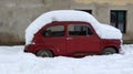 Old red Fiat under snow Royalty Free Stock Photo