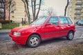 Old red Fiat Uno Fire left side and front view parked