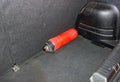 Old red fire extinguisher in the trunk of a car Royalty Free Stock Photo