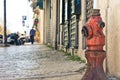 Old red fire hydrant on the street Royalty Free Stock Photo