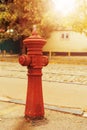 Old red fire hydrant water pipe near the road Royalty Free Stock Photo
