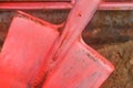 Old red fire shovel equipment and tools to help safely extinguish fire Royalty Free Stock Photo