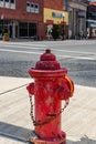 Old, red, fireman, hydrant on the side of a historic American city