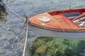 Old red fishing red boat tied on dock Royalty Free Stock Photo