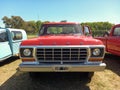 Old red 1979 Ford F 100 pickup truck in the countryside. Nature. Autoclasica 2022 classic car show