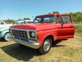 Old red 1979 Ford F 100 pickup truck in the countryside. Nature. Autoclasica 2022 classic car show