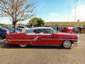 Old red 1955 Ford Mercury Montclair two door hardtop in a parking lot. Classic car show. Royalty Free Stock Photo