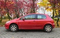 Old red small French family compact car 3-door hatchback body Peugeot 307 Royalty Free Stock Photo