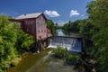 Old Grist Mill with Water Wheel and Dam Royalty Free Stock Photo