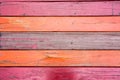 Old, red grunge wood vertical panels on a rustic barn Royalty Free Stock Photo