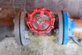 Old red hand wheel of valve Royalty Free Stock Photo