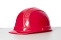 Old Red Hard Hat With Shadow and Copy Space Royalty Free Stock Photo